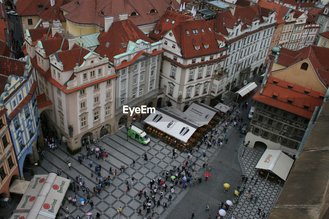 HIGH ANGLE VIEW OF PEOPLE ON STREET