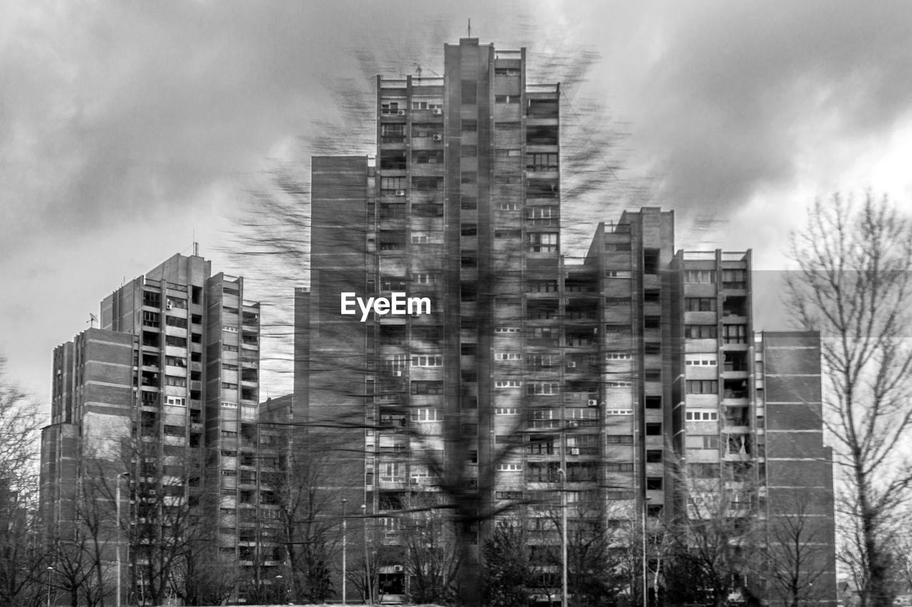  image of modern buildings against sky on the move