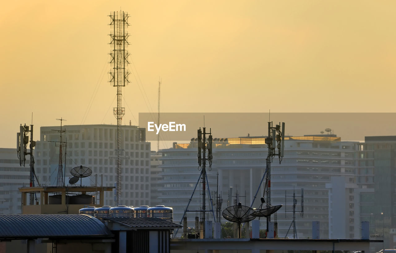 BUILDINGS AGAINST SKY AT SUNSET