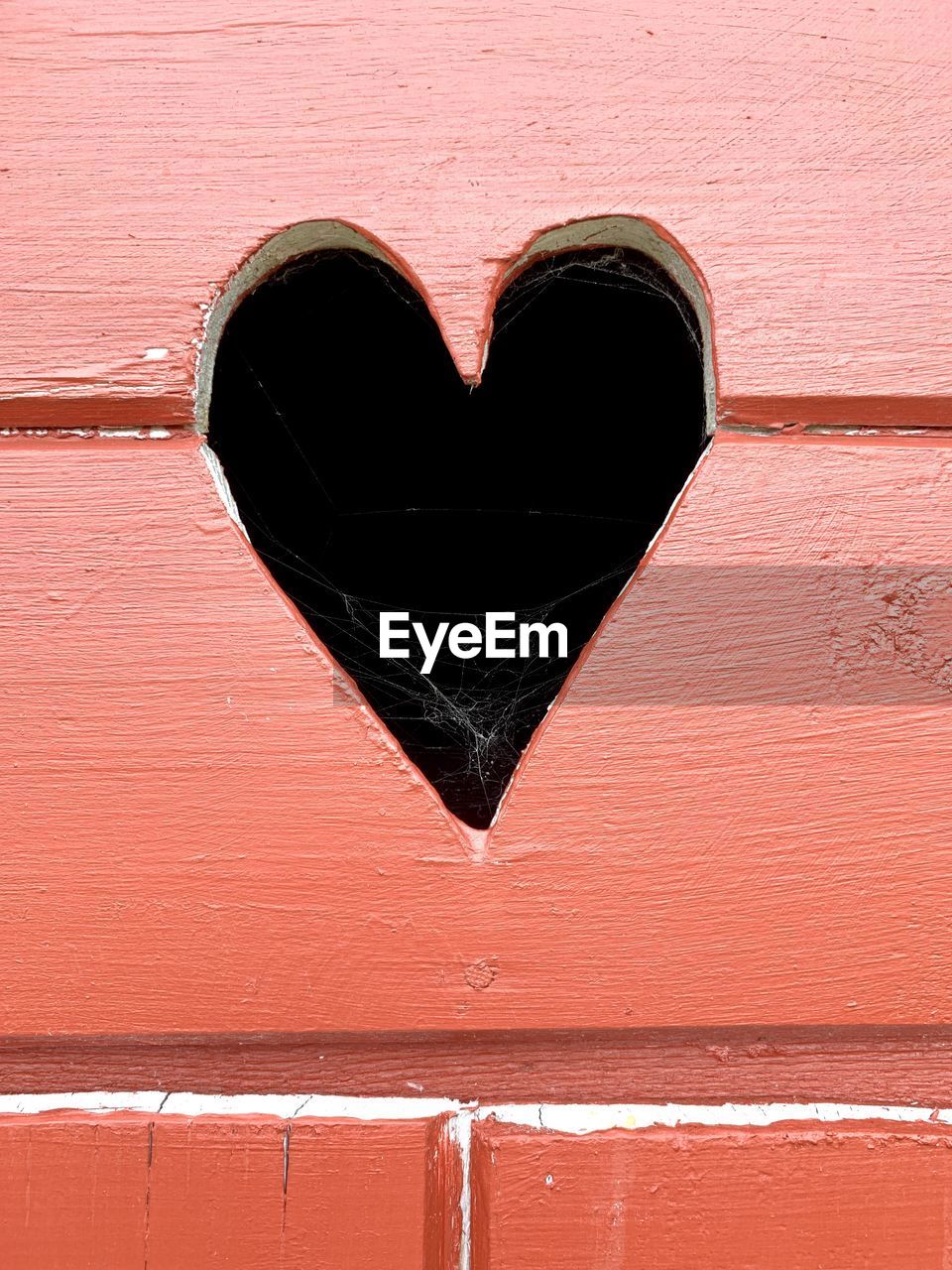 Close-up of heart shape on wooden  wall