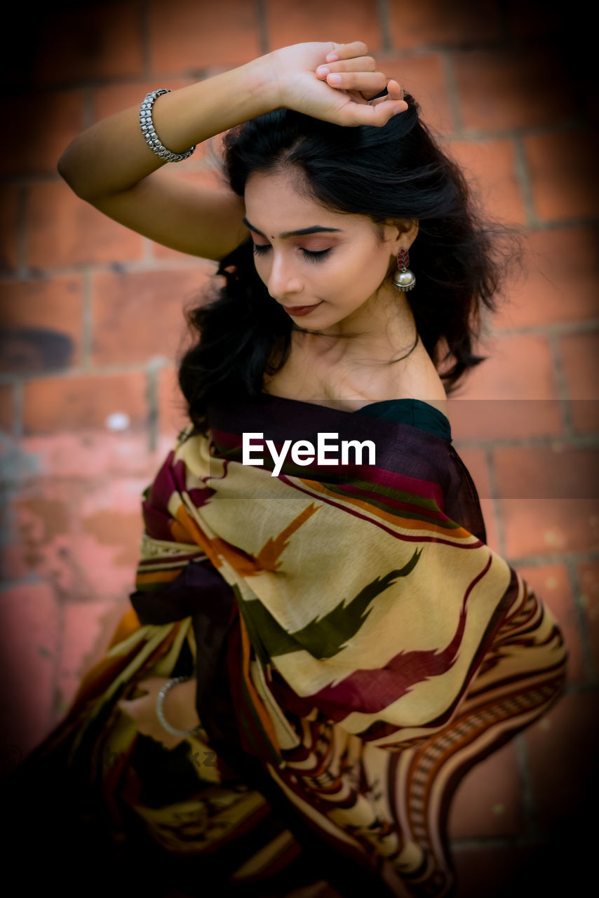 Portrait of young woman looking away