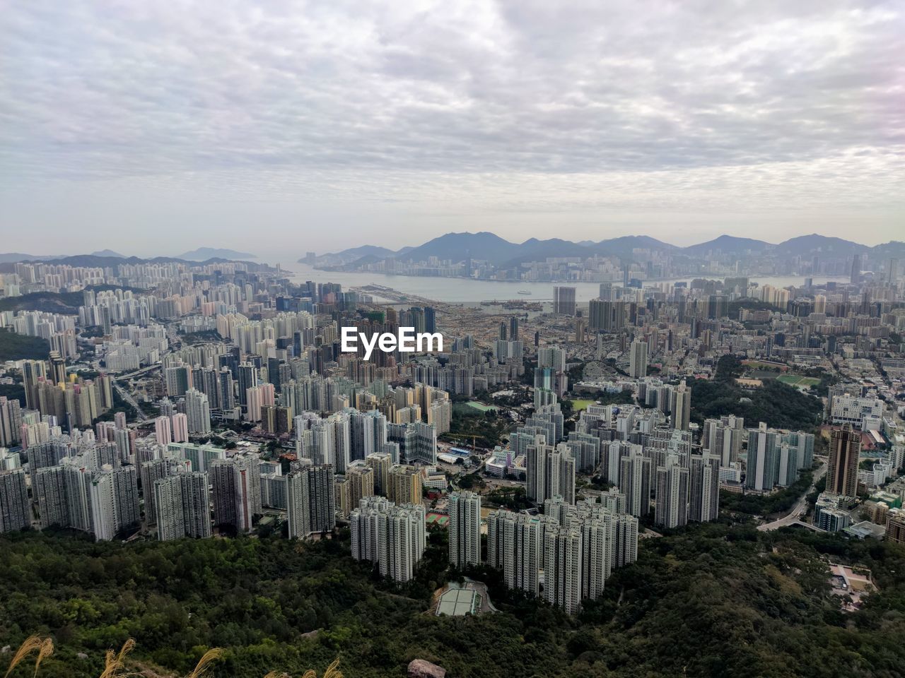 AERIAL VIEW OF CITY BUILDINGS AGAINST SKY