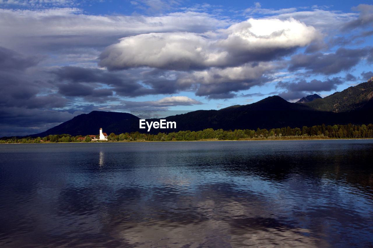 SCENIC VIEW OF LAKE AGAINST CLOUDY SKY