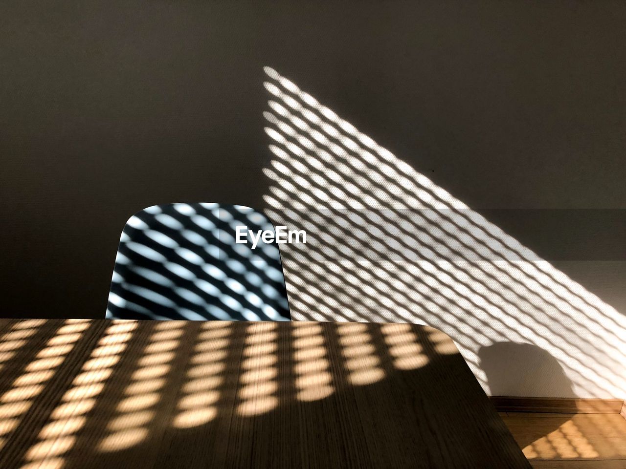 CLOSE-UP OF SUNLIGHT FALLING ON TABLE