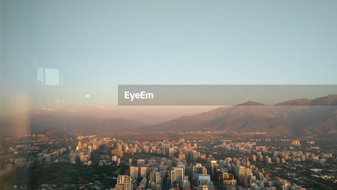 HIGH ANGLE SHOT OF TOWNSCAPE AGAINST SKY