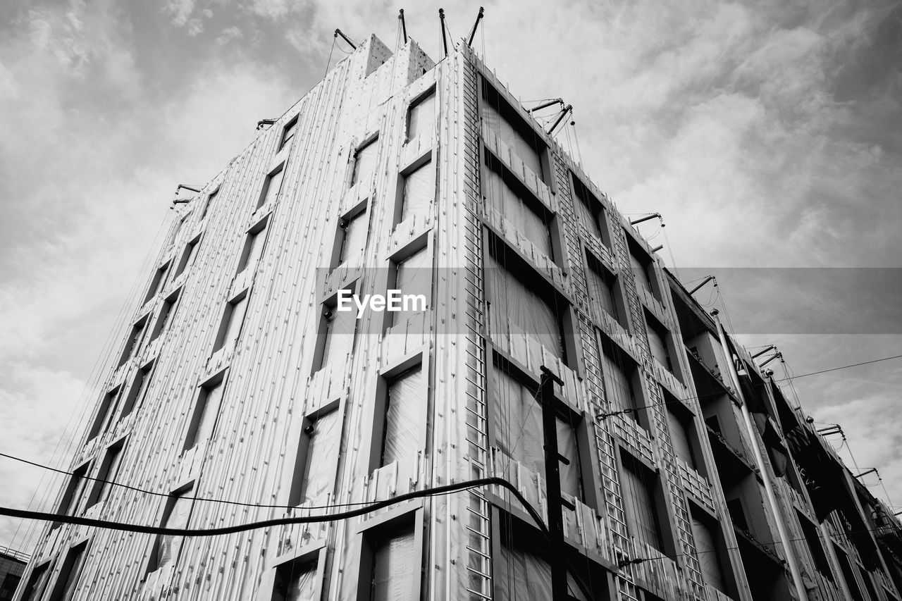 architecture, building exterior, built structure, sky, low angle view, urban area, building, black and white, cloud, monochrome, no people, city, monochrome photography, window, skyscraper, nature, tower block, residential district, day, house, outdoors, construction industry, white, industry, facade