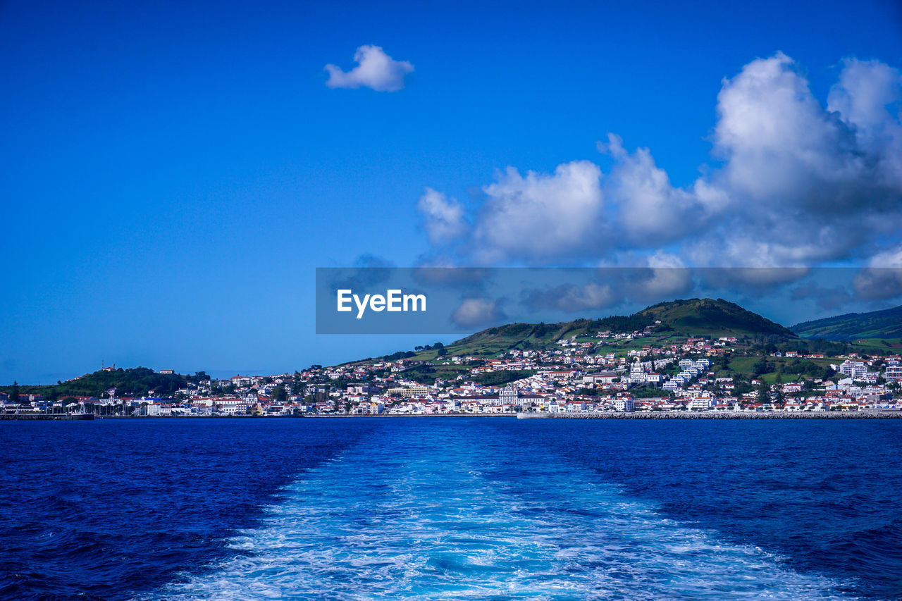 water, sea, horizon, sky, ocean, architecture, blue, city, nature, cloud, mountain, land, coast, travel destinations, scenics - nature, building exterior, body of water, travel, shore, no people, beach, built structure, beauty in nature, building, dusk, outdoors, bay, coastline, wave, environment, landscape, tourism, cityscape, island, day, holiday, waterfront, nautical vessel, tranquility, transportation, tranquil scene, vacation, trip