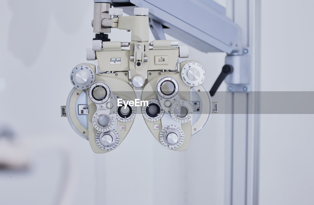 Phoropter, medical optometry and equipment in hospital for eye test or examination.