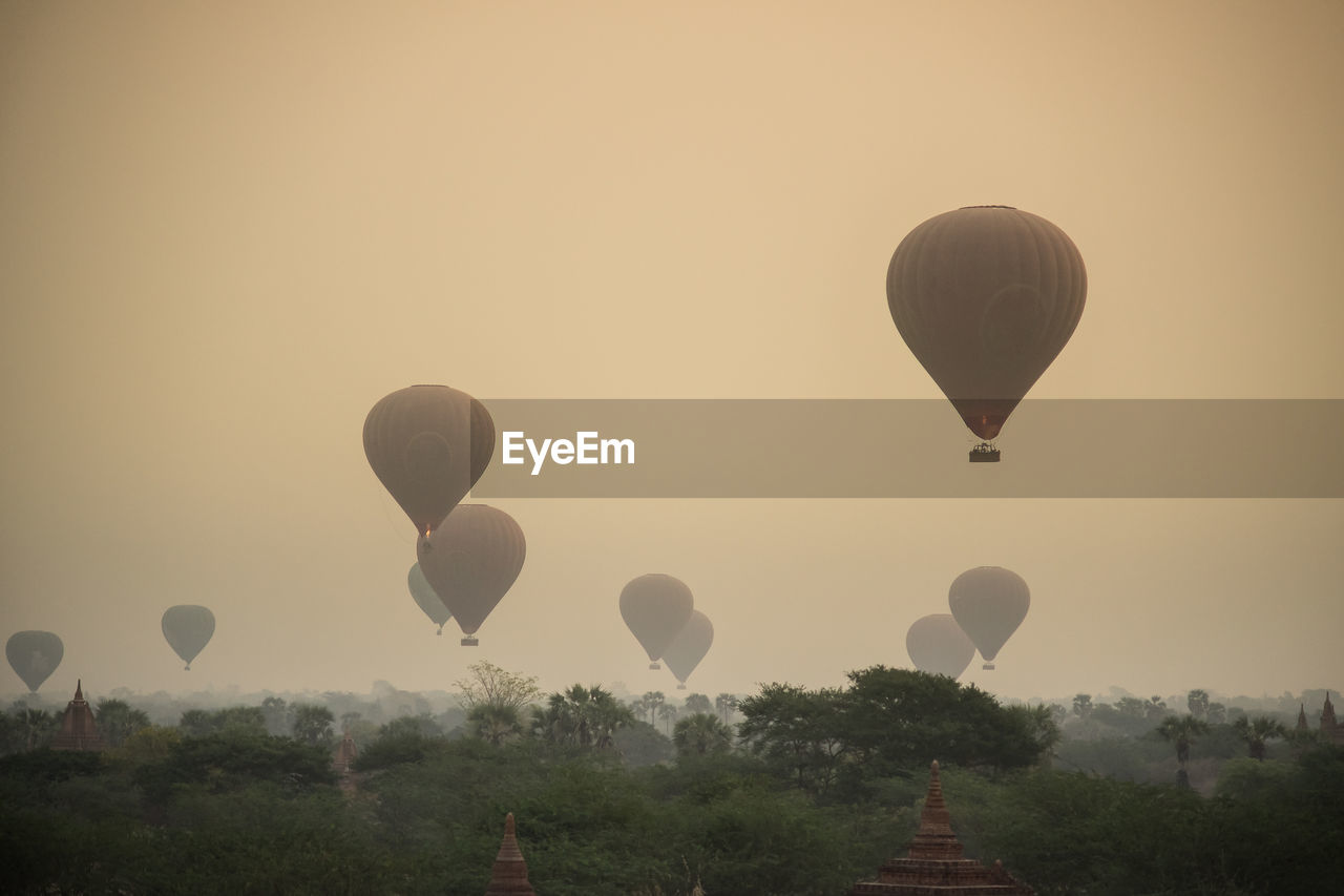 HOT AIR BALLOON AGAINST SKY AT SUNSET