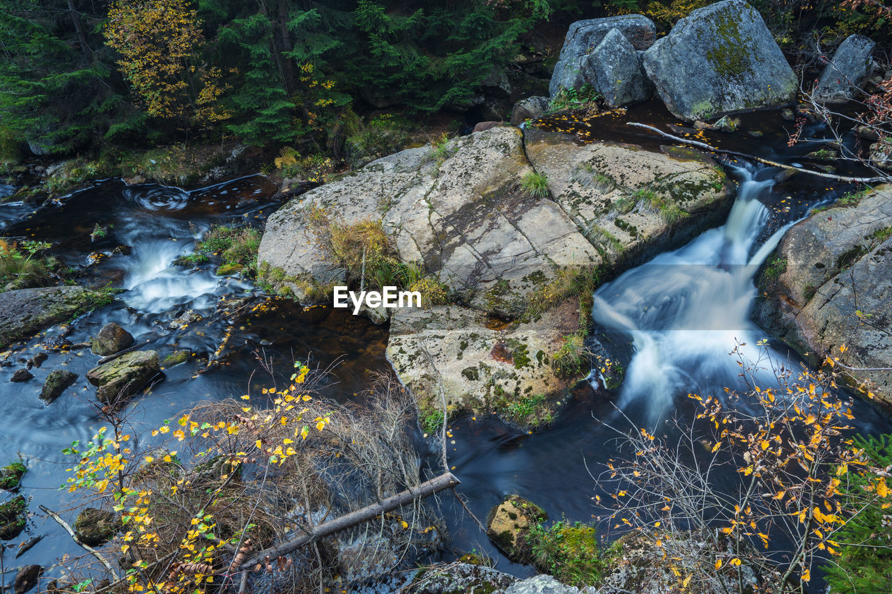 STREAM FLOWING THROUGH ROCKS