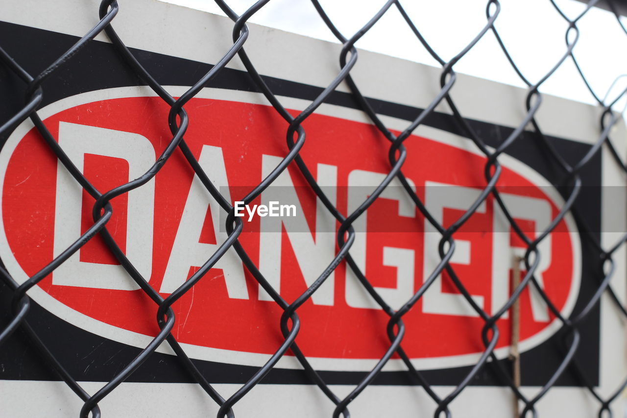 Close-up of danger signboard