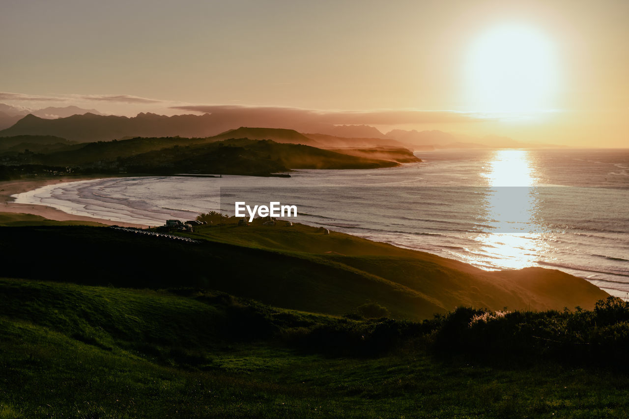 Scenic view of sea against sky during sunset