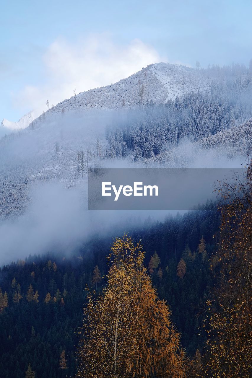 Scenic view of mountains against sky during winter