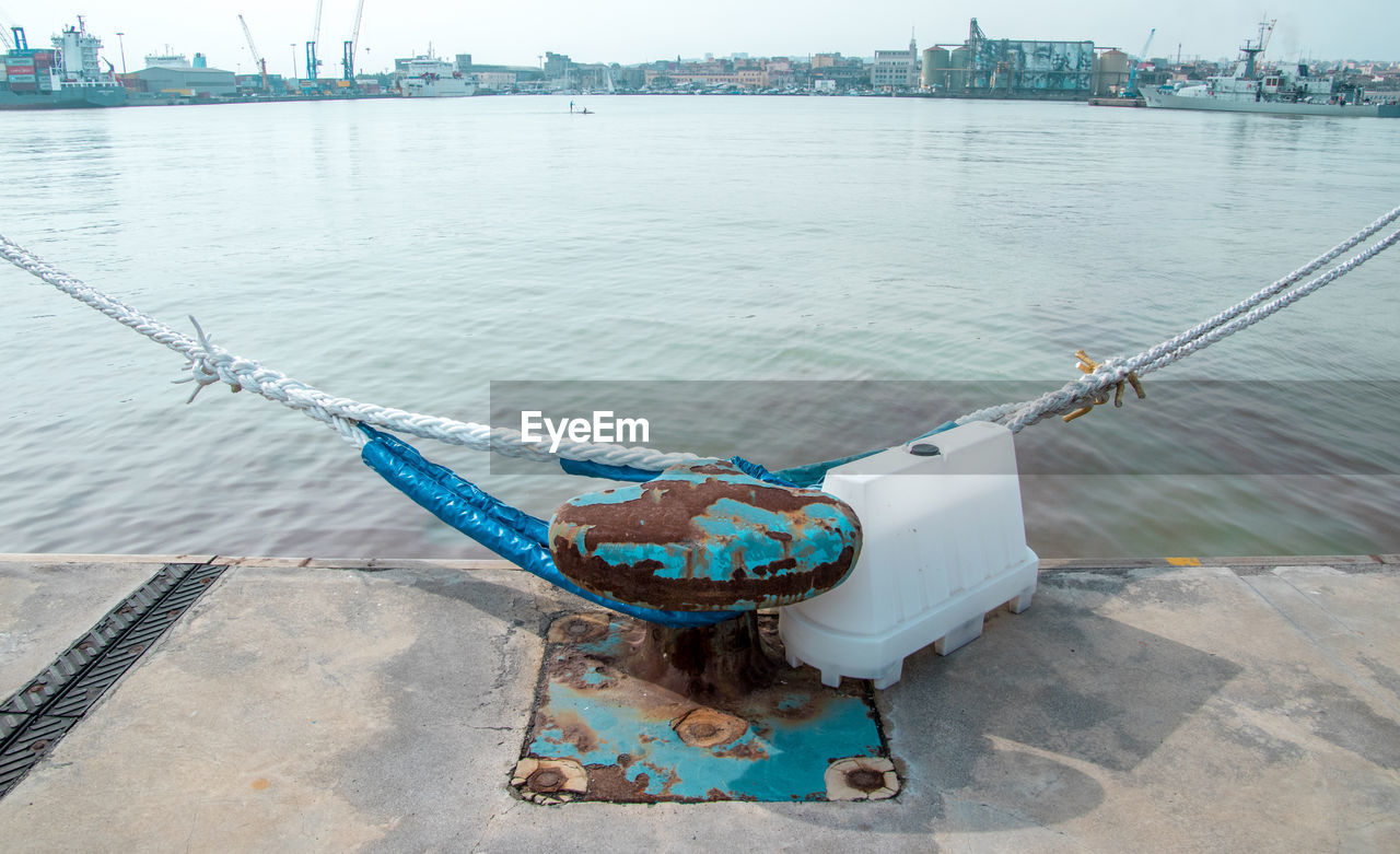 HIGH ANGLE VIEW OF SHIP MOORED IN HARBOR