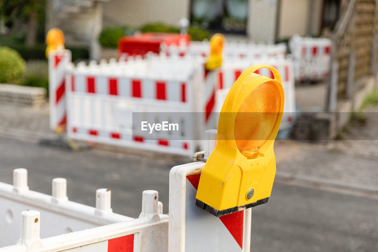 Work construction site sign cordoning off on a road