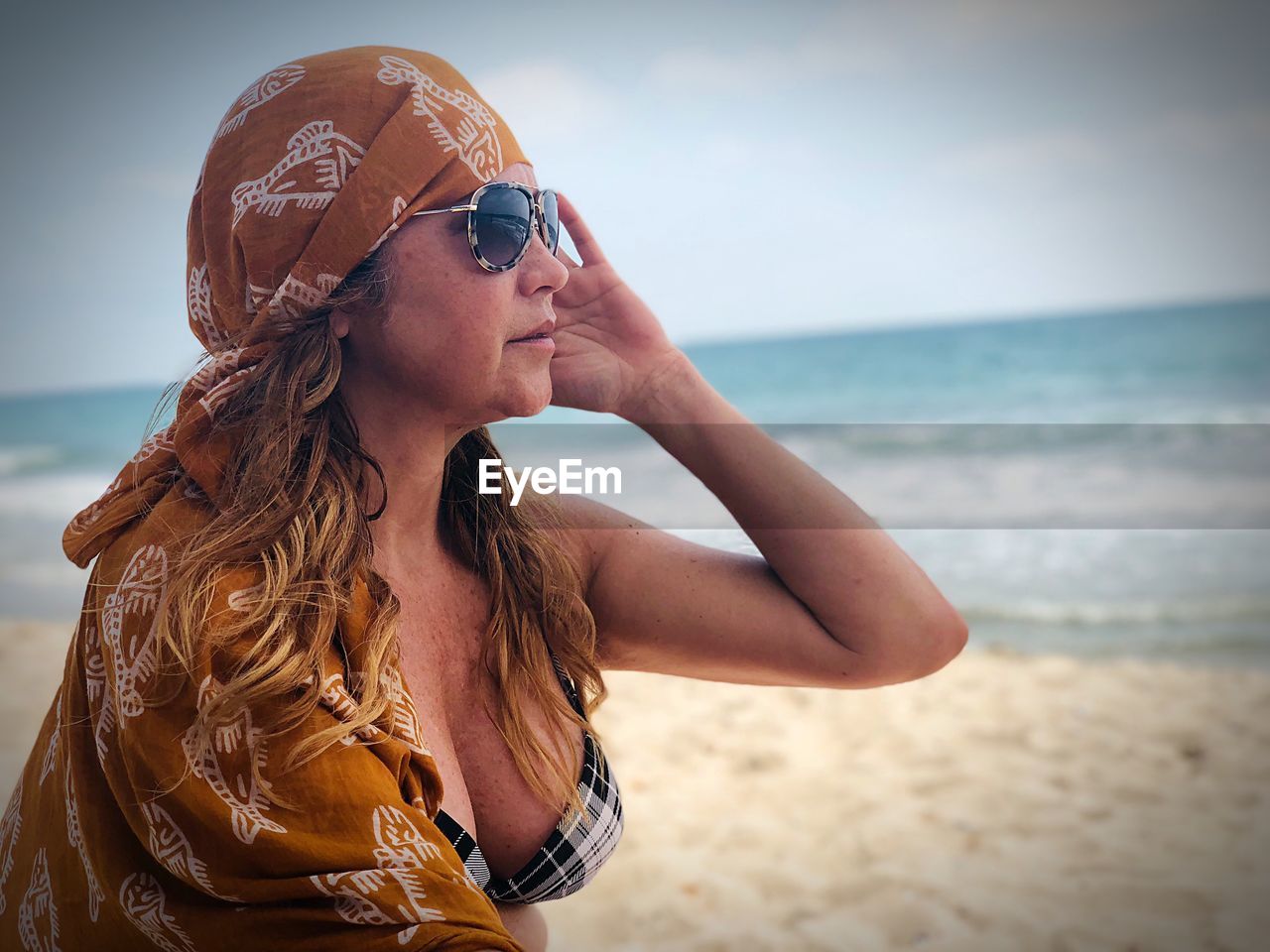 Sensuous woman standing on beach