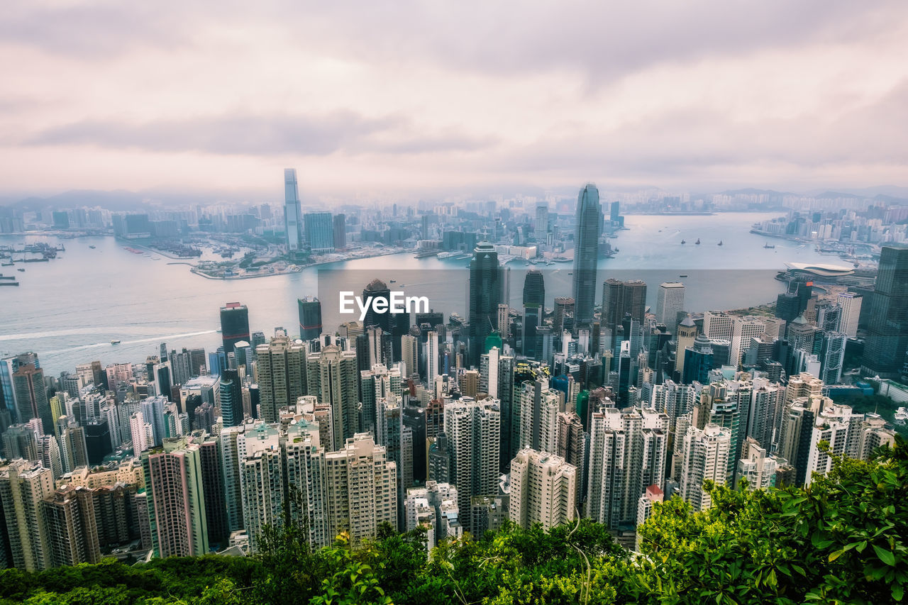 High angle view of modern buildings in city against sky