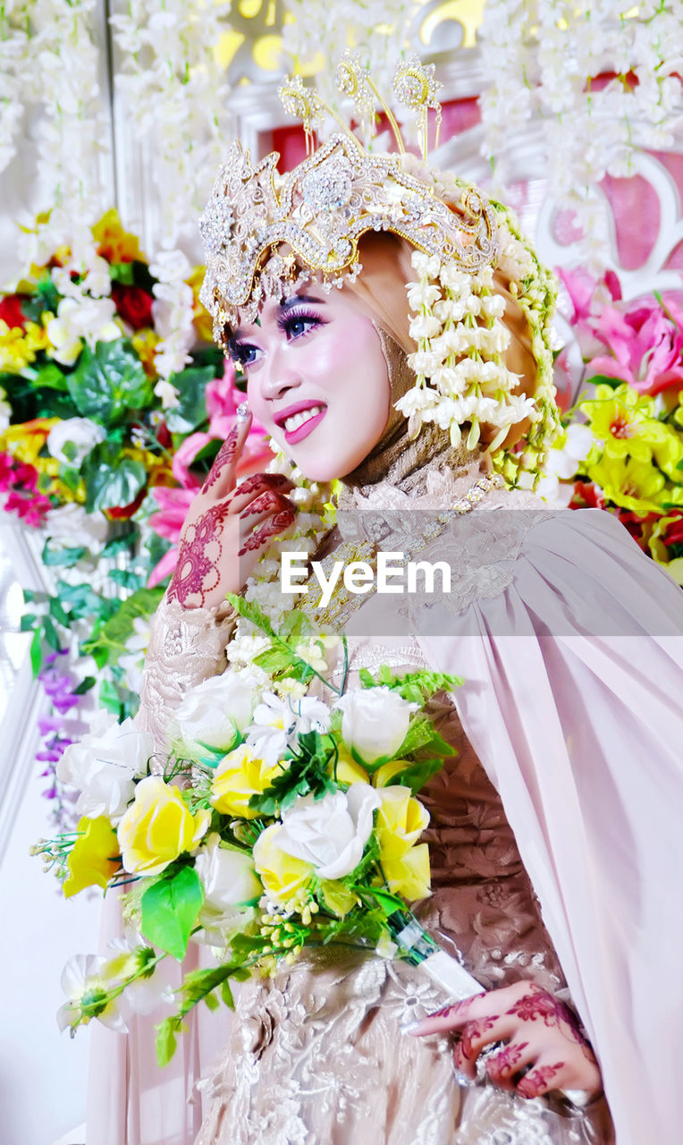 Portrait of bride holding bouquet