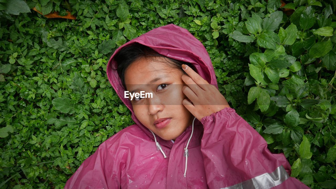 Portrait of cute girl in rain