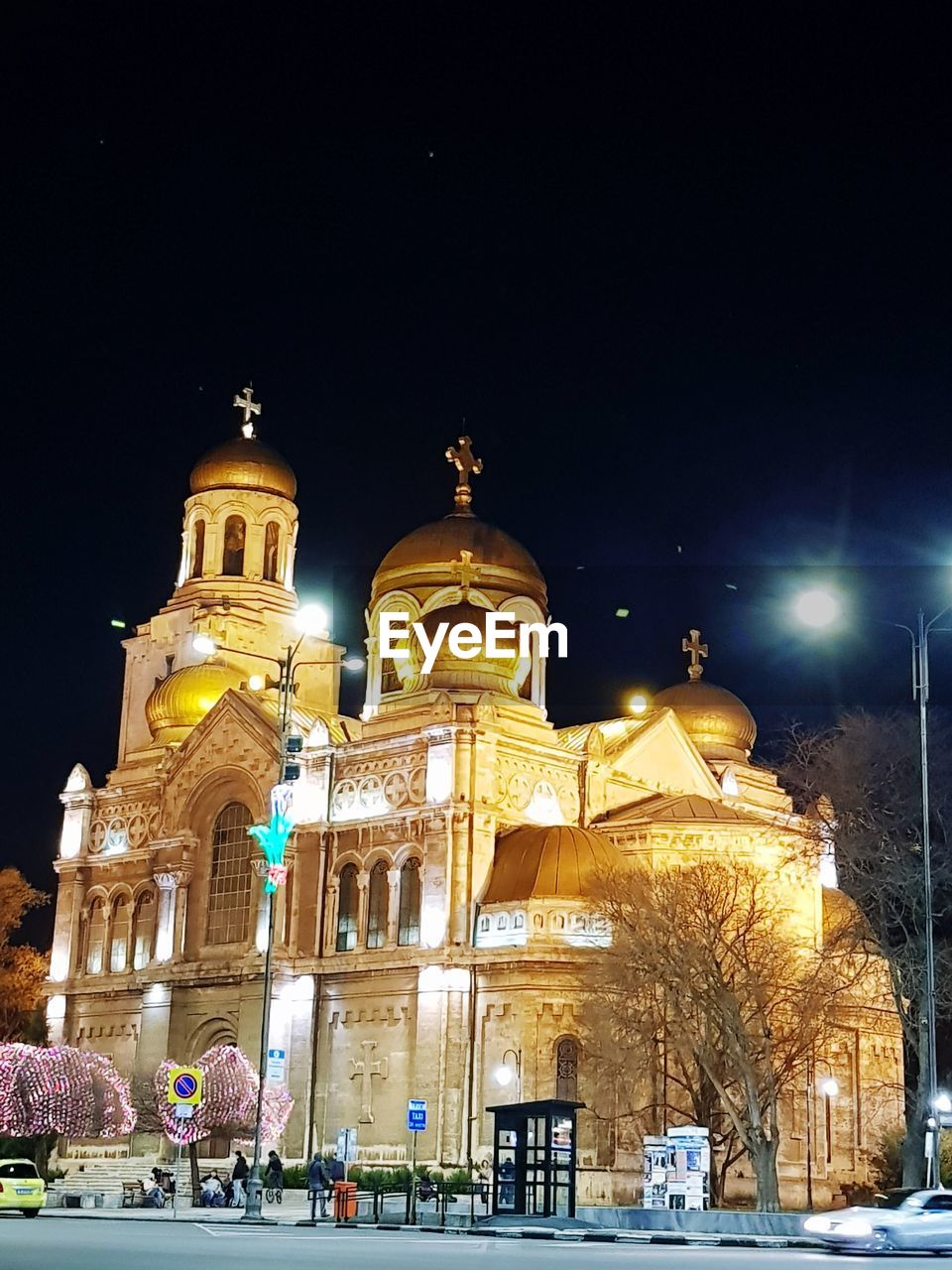 LOW ANGLE VIEW OF ILLUMINATED CATHEDRAL DURING WINTER