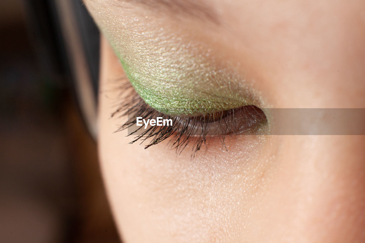 Close up of eye of young woman with makeup