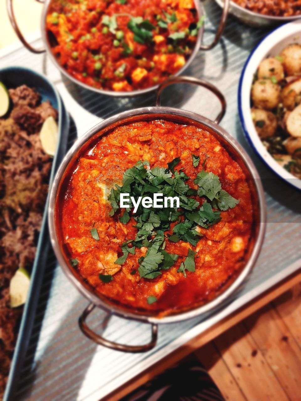 High angle view of food on table, brightly coloured homemade curry