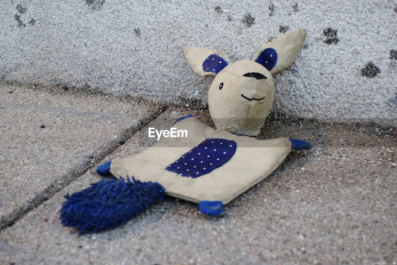 High angle view of stuffed toy on sand