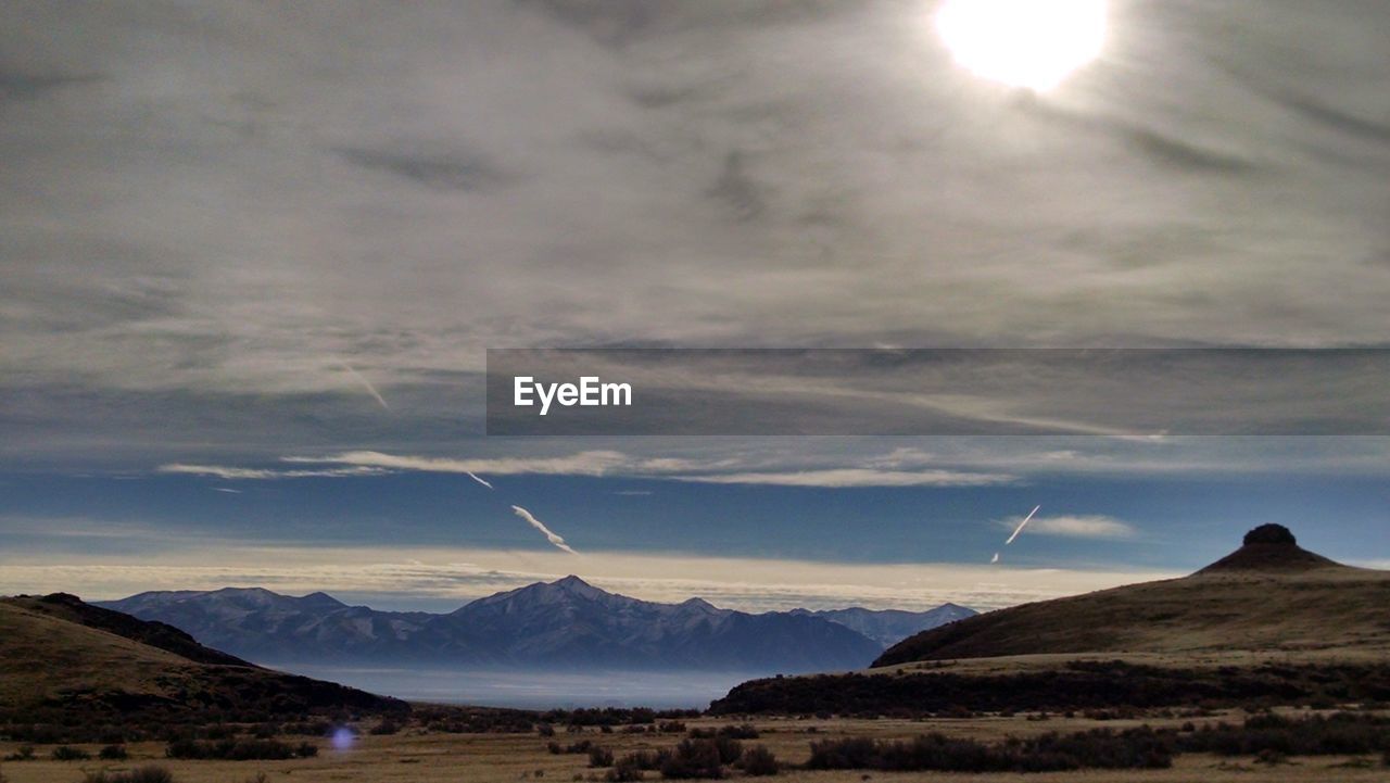 Scenic view of mountains against sky during sunset