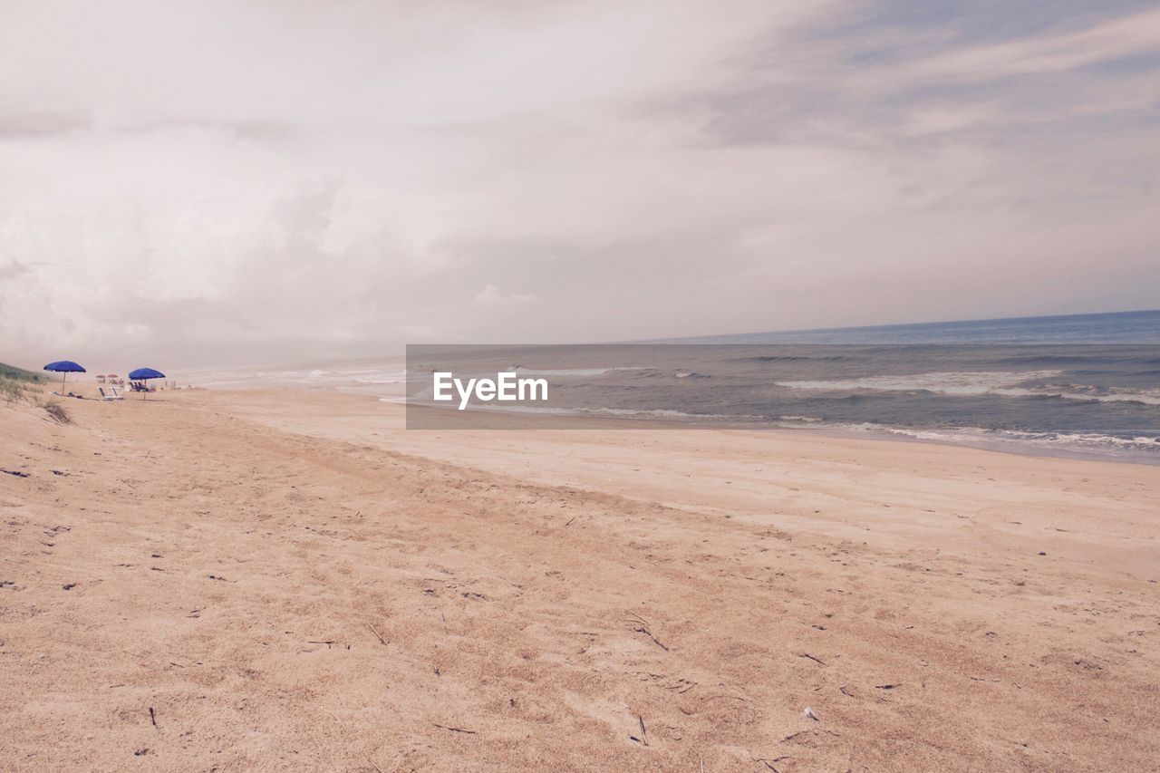 Scenic view of beach against sky