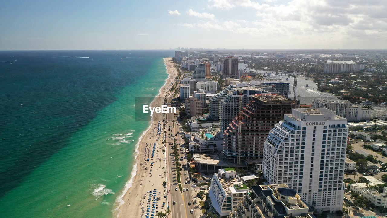 HIGH ANGLE VIEW OF BUILDINGS AGAINST SKY