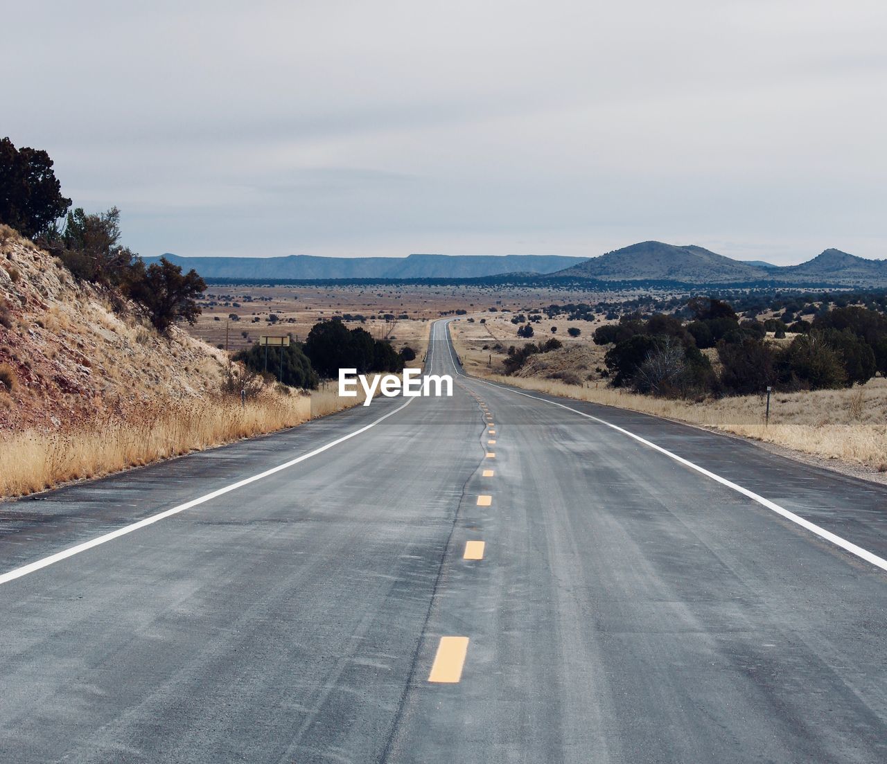 Empty road against sky