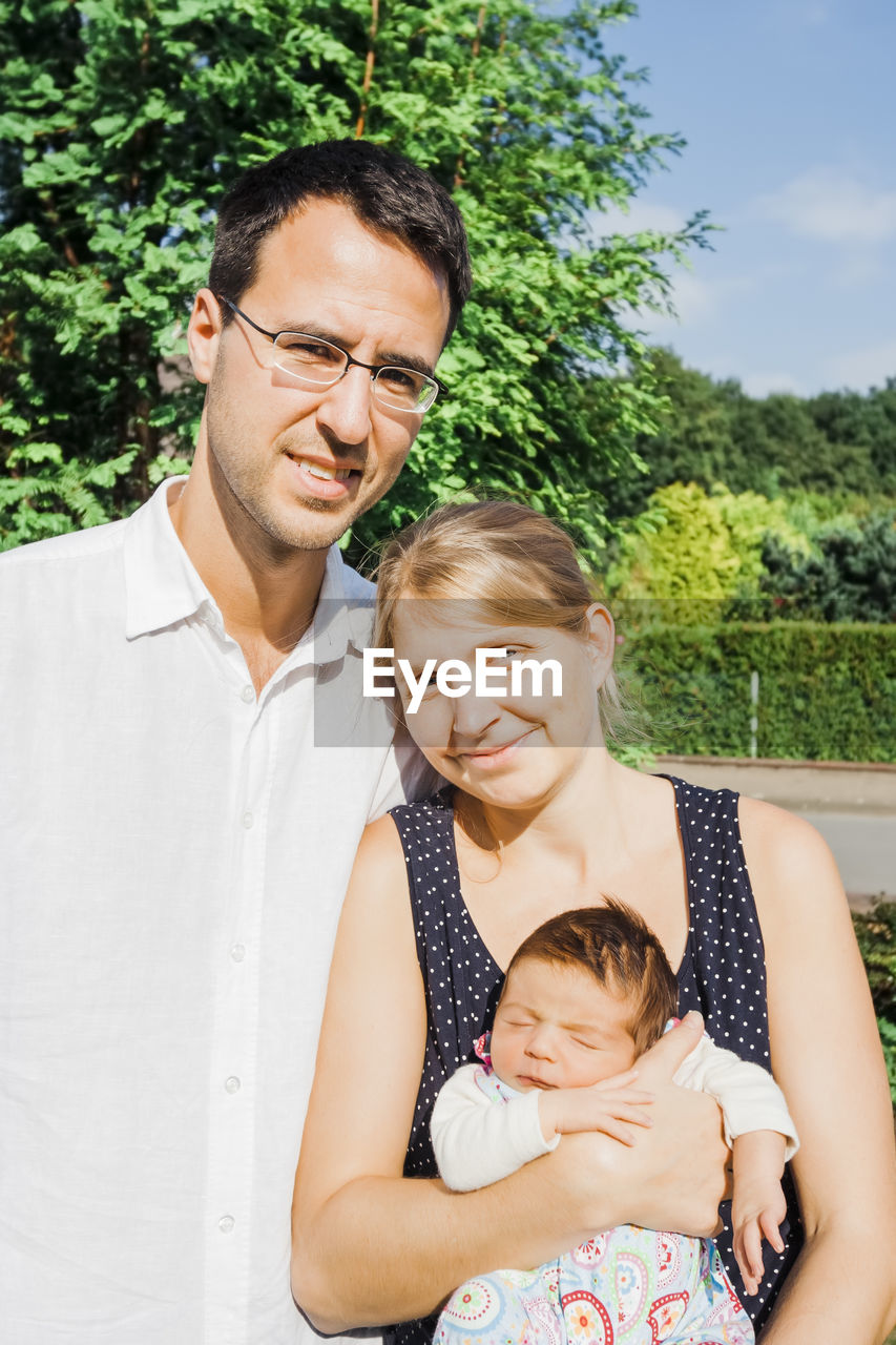 Portrait of happy family outdoors