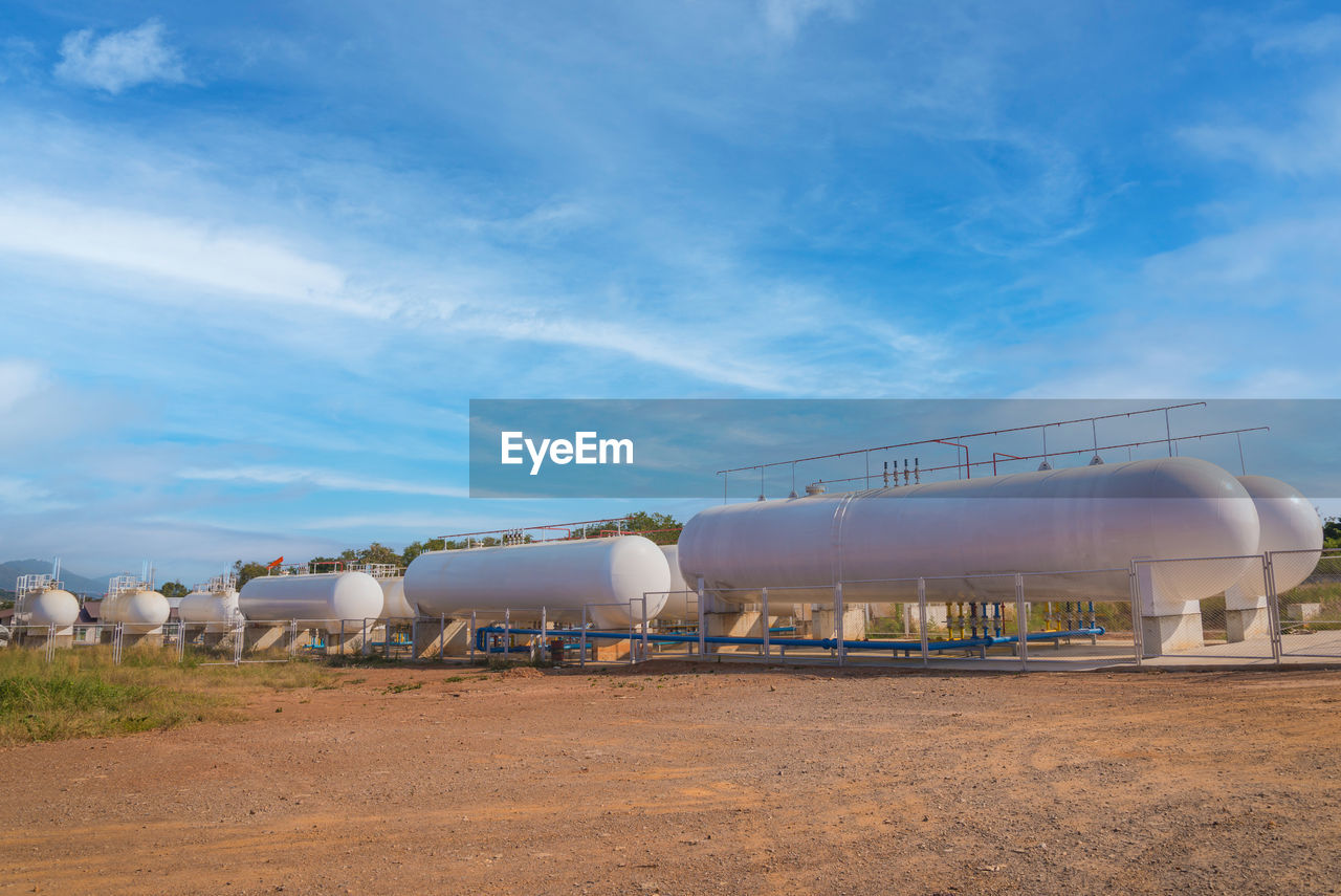 Natural gas storage tanks in industrial plant.