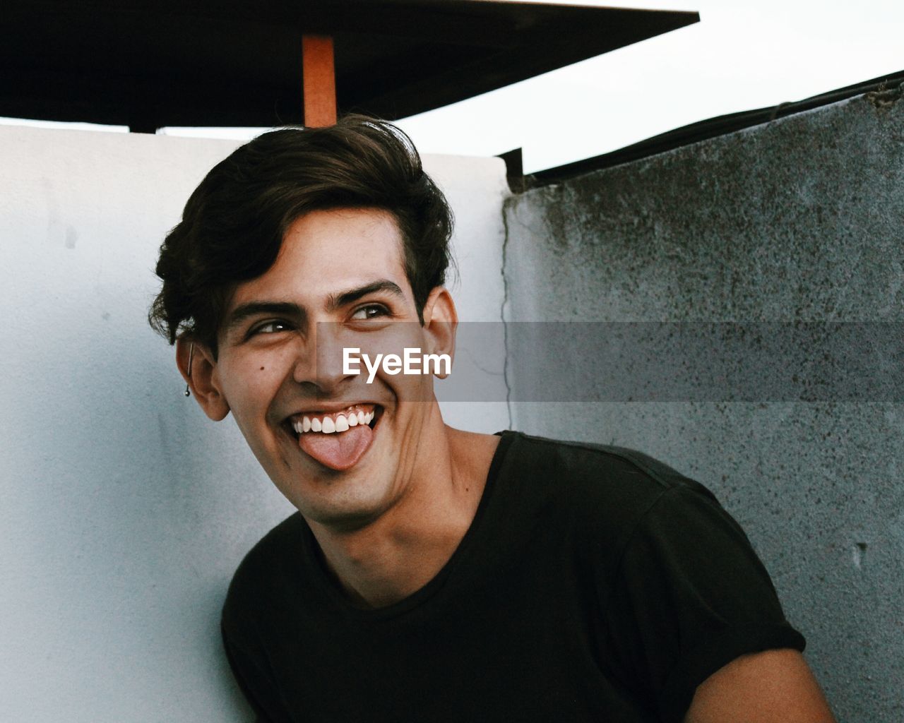 Portrait of smiling young man at home