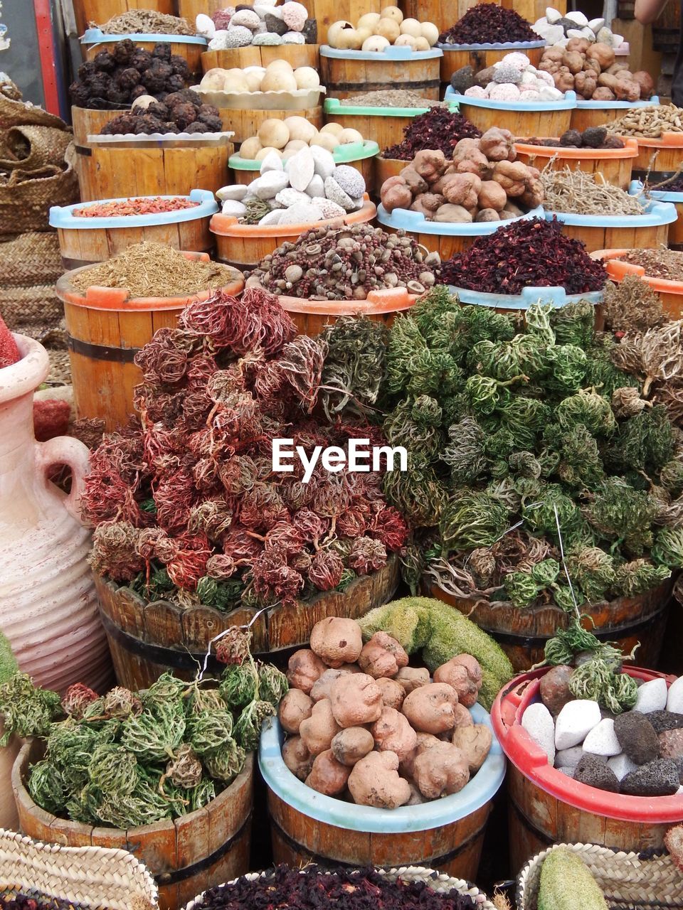 High angle view of various spices in sacks for sale at market stall