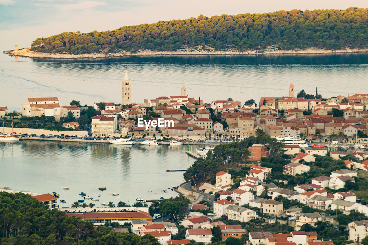 High angle view of townscape by sea