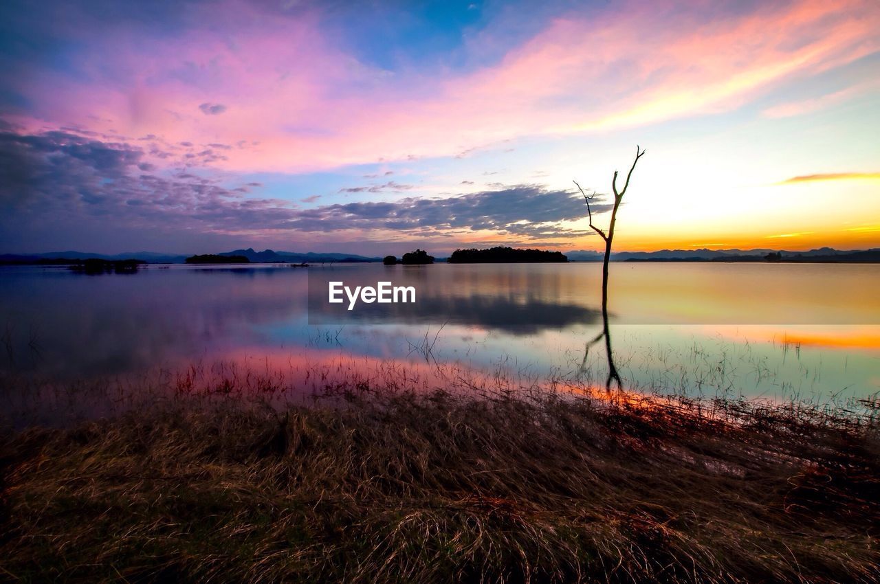 Scenic view of lake at sunset