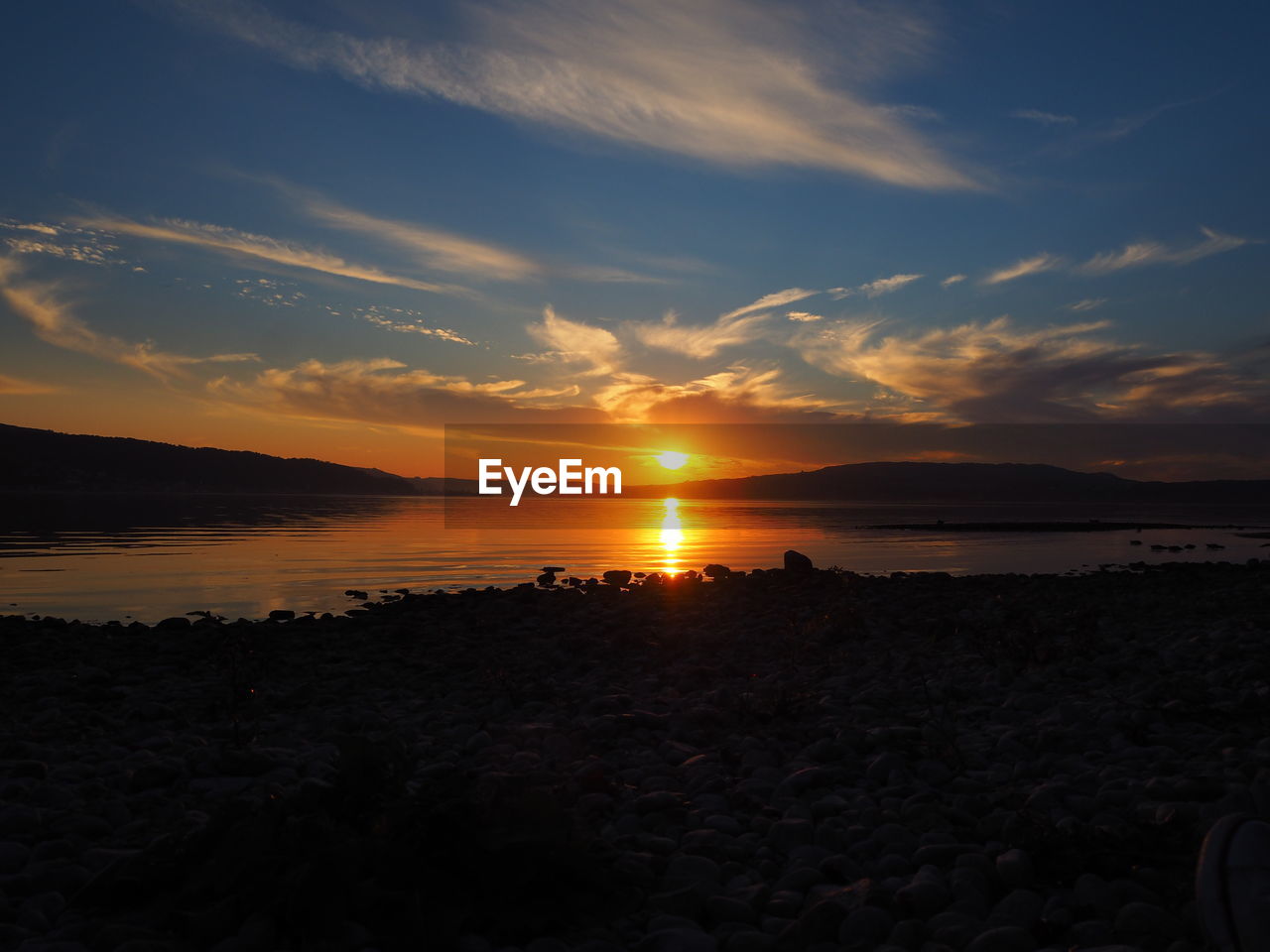 Scenic view of sea against sky during sunset