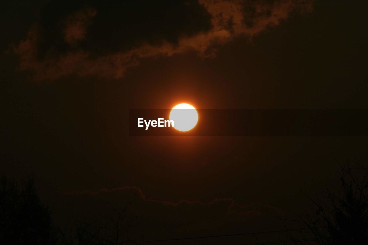 LOW ANGLE VIEW OF SILHOUETTE MOON AGAINST SKY