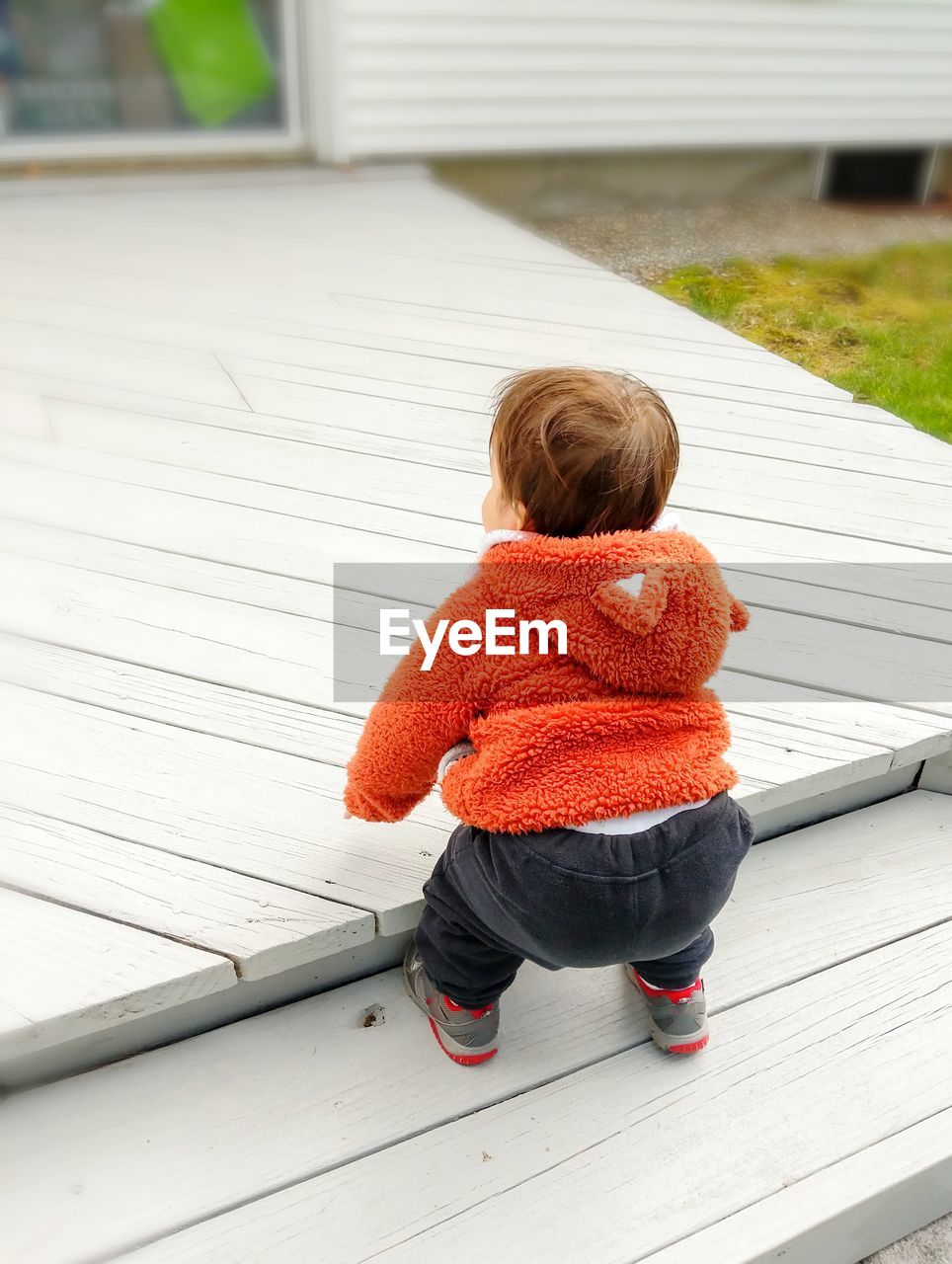 Toddler learning to climb stairs