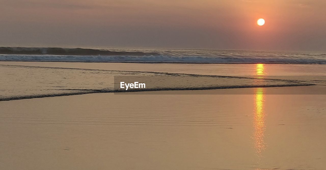 SCENIC VIEW OF SEA DURING SUNSET