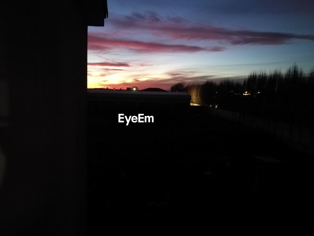 SILHOUETTE OF BUILDING AT SUNSET