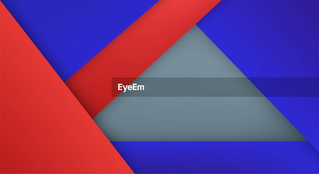 HIGH ANGLE VIEW OF MULTI COLORED PATTERN ON BLUE BACKGROUND