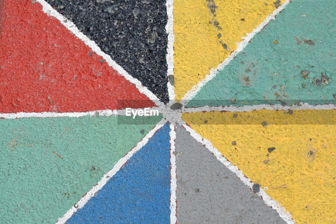 HIGH ANGLE VIEW OF MULTI COLORED WALL