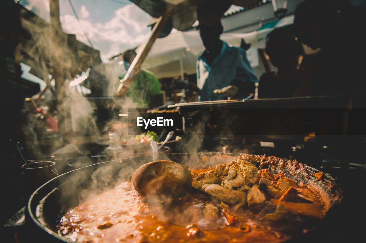 Steam in cooking pot at stall