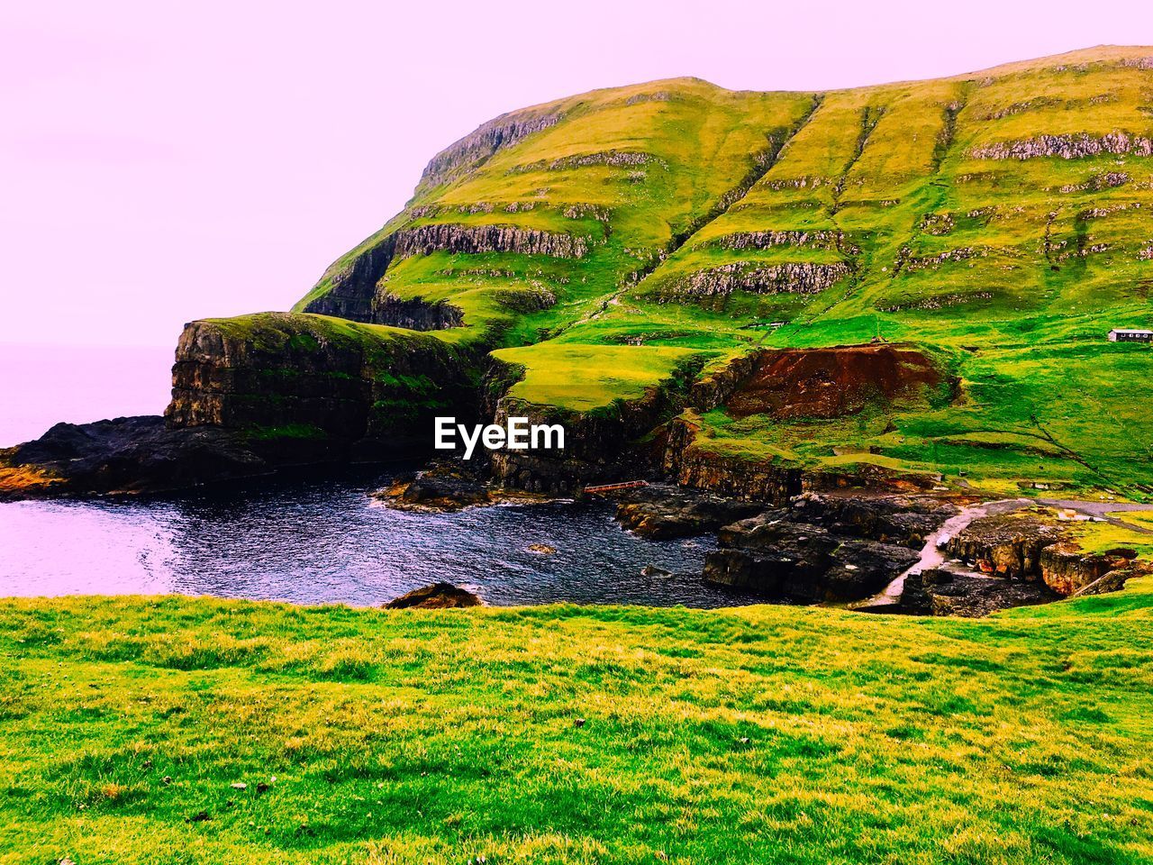 SCENIC VIEW OF SEA BY CLIFF AGAINST SKY