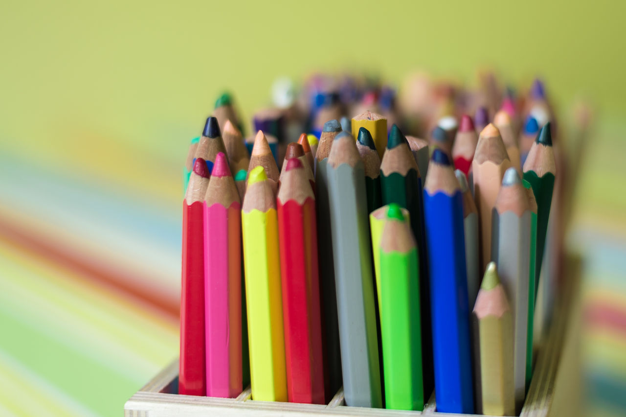 Close-up of colored pencils in desk organizer