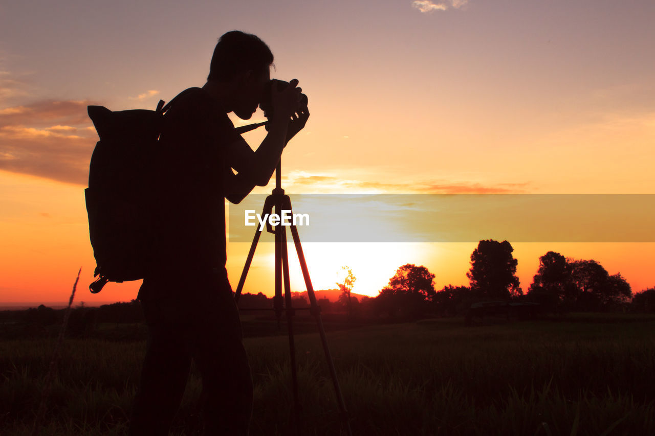 Silhouette of photography with a sunset setting