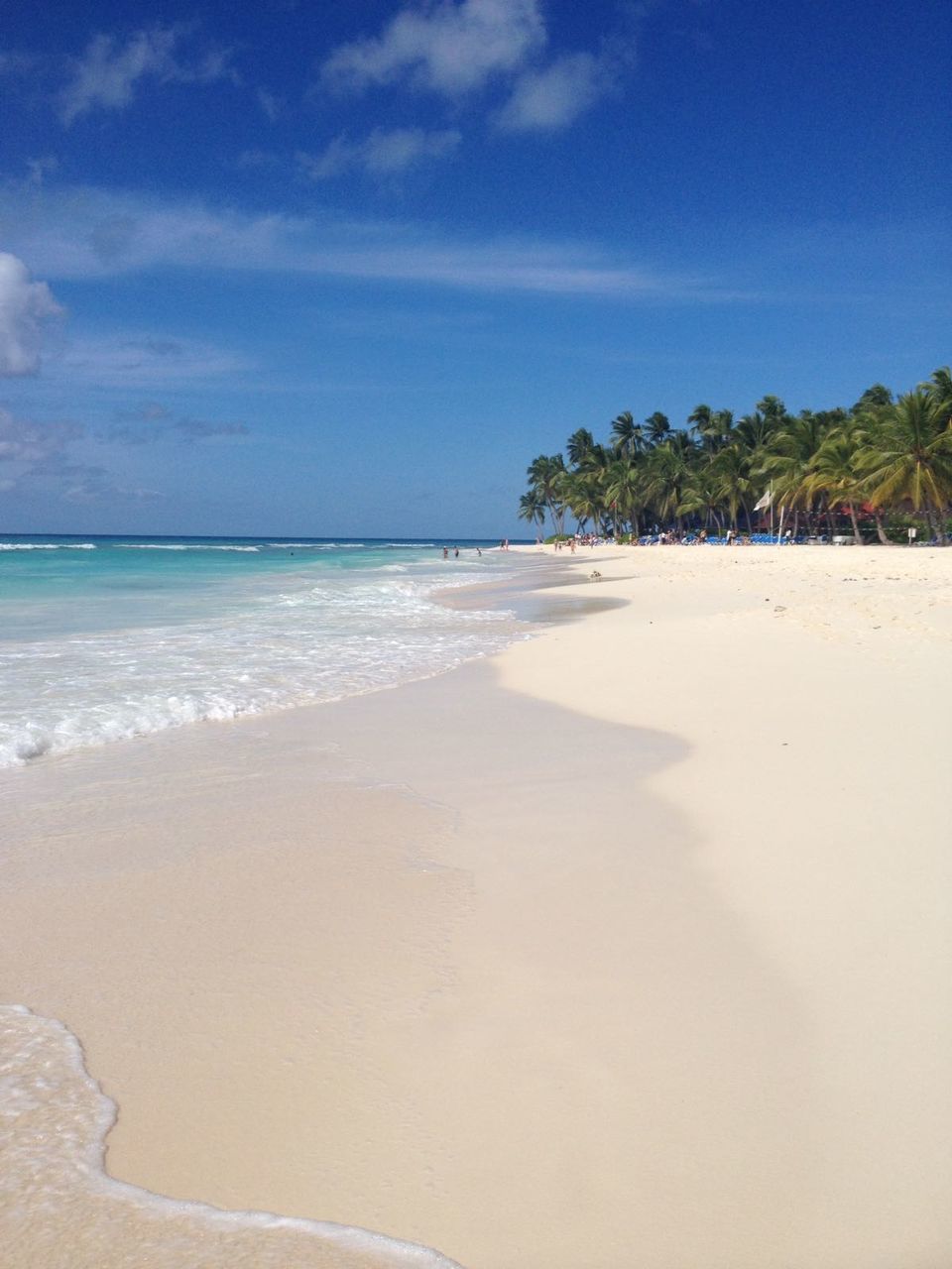 Scenic view of beach against blue sky