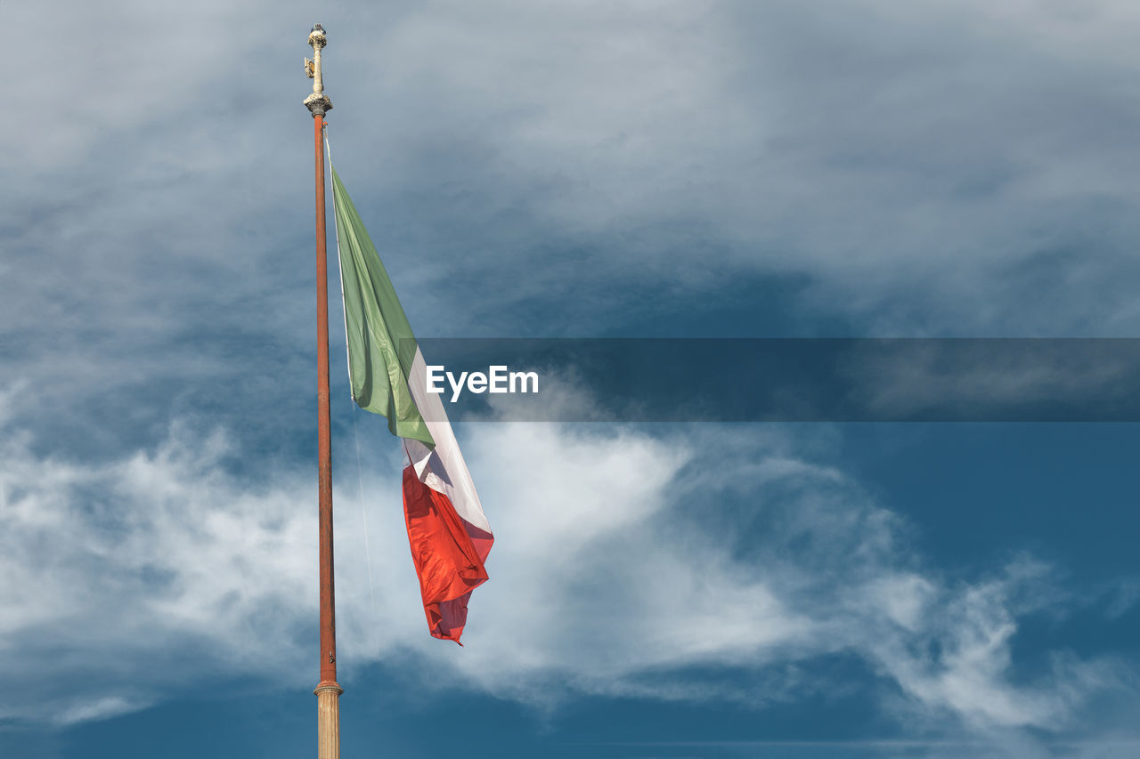 flag, patriotism, sky, cloud, wind, blue, nature, environment, pole, mast, day, low angle view, no people, independence, outdoors, red, symbolism, pride, national icon